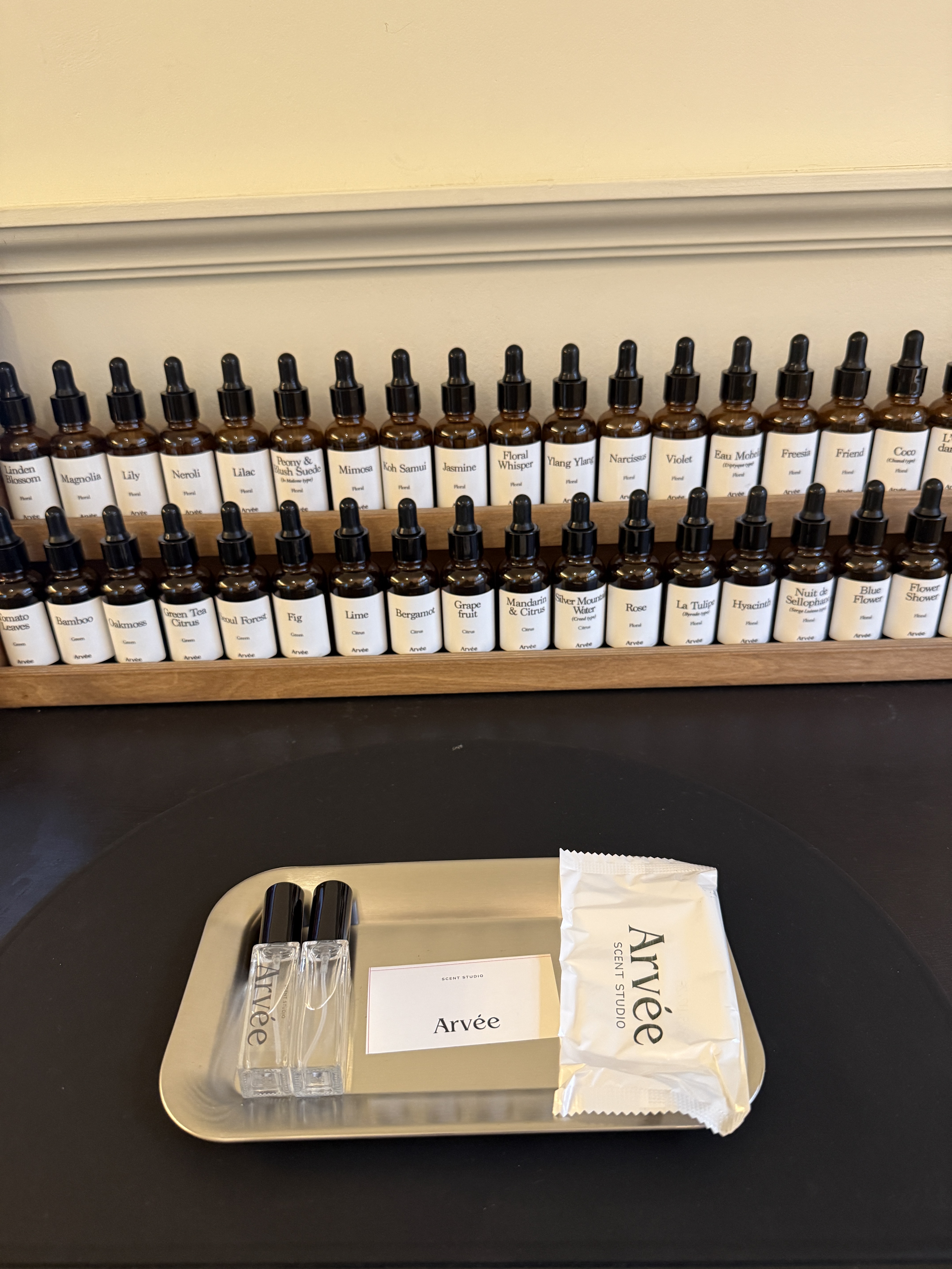 Stainless steel blending sample tray with perfume vials and Arvee branding