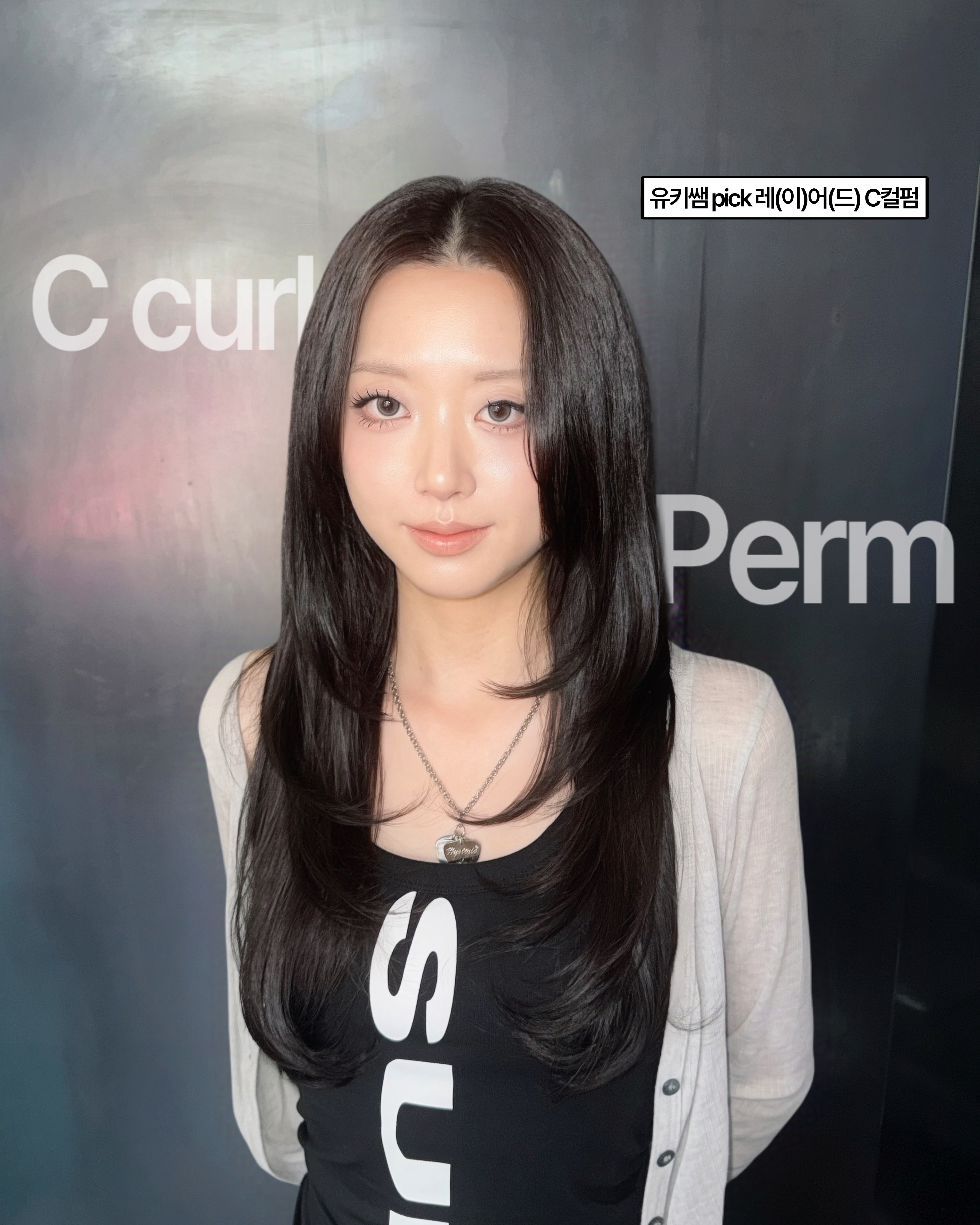 Client with styled C-curl perm and layered haircut