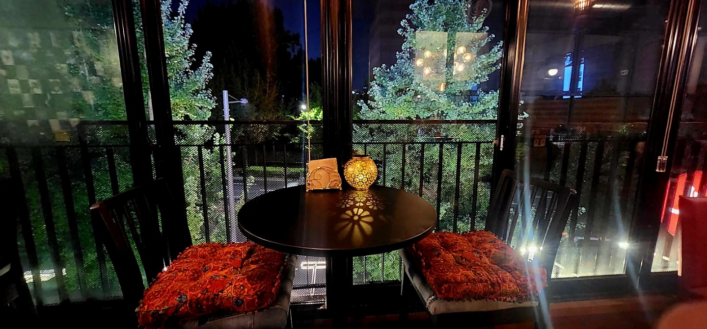 Cozy window table at night with ambient floral lamp