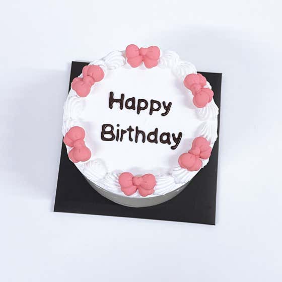 Elegant bow and lettering cake