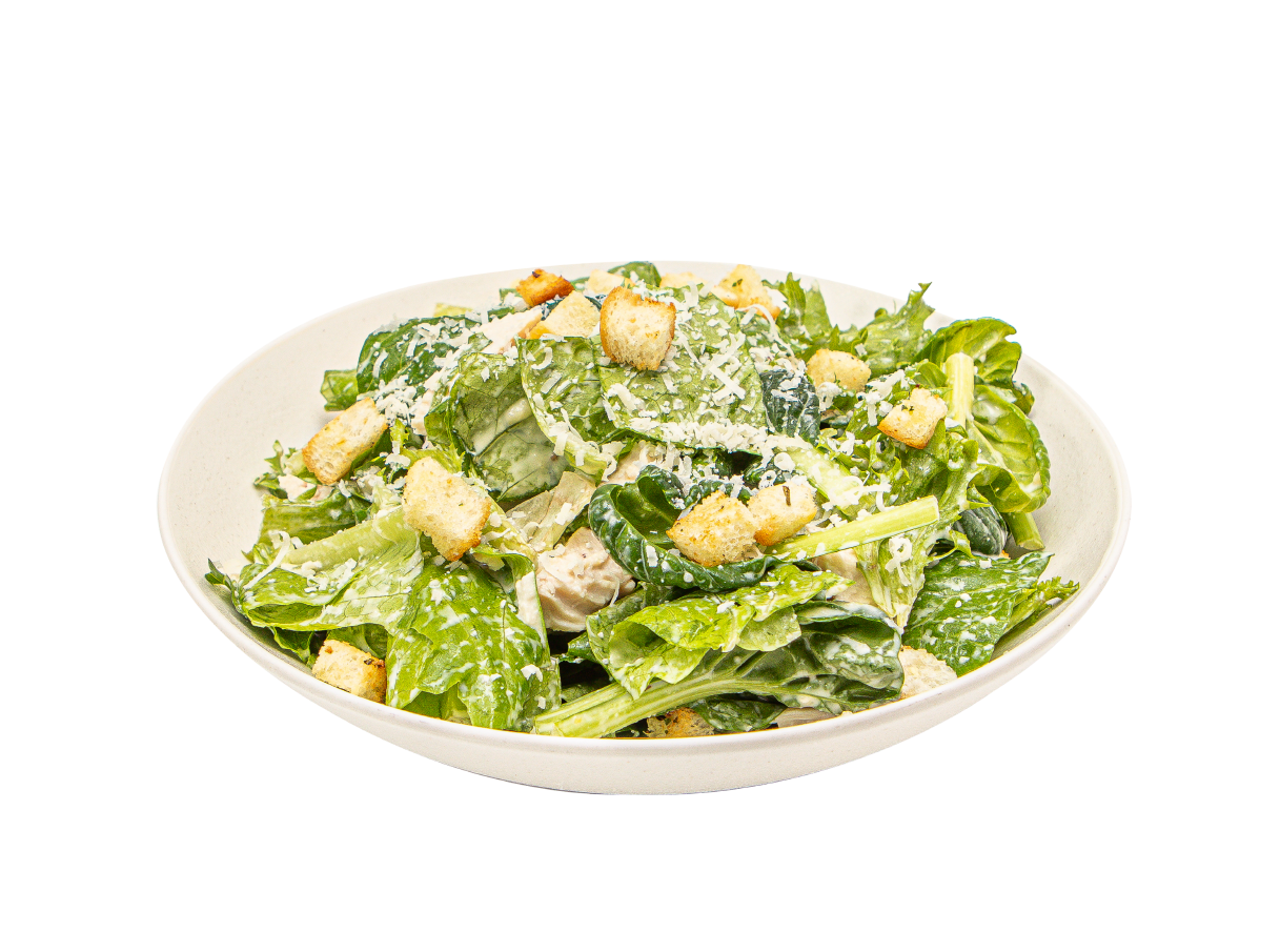 Fresh Caesar salad with crisp greens, golden croutons, and house-made dressing