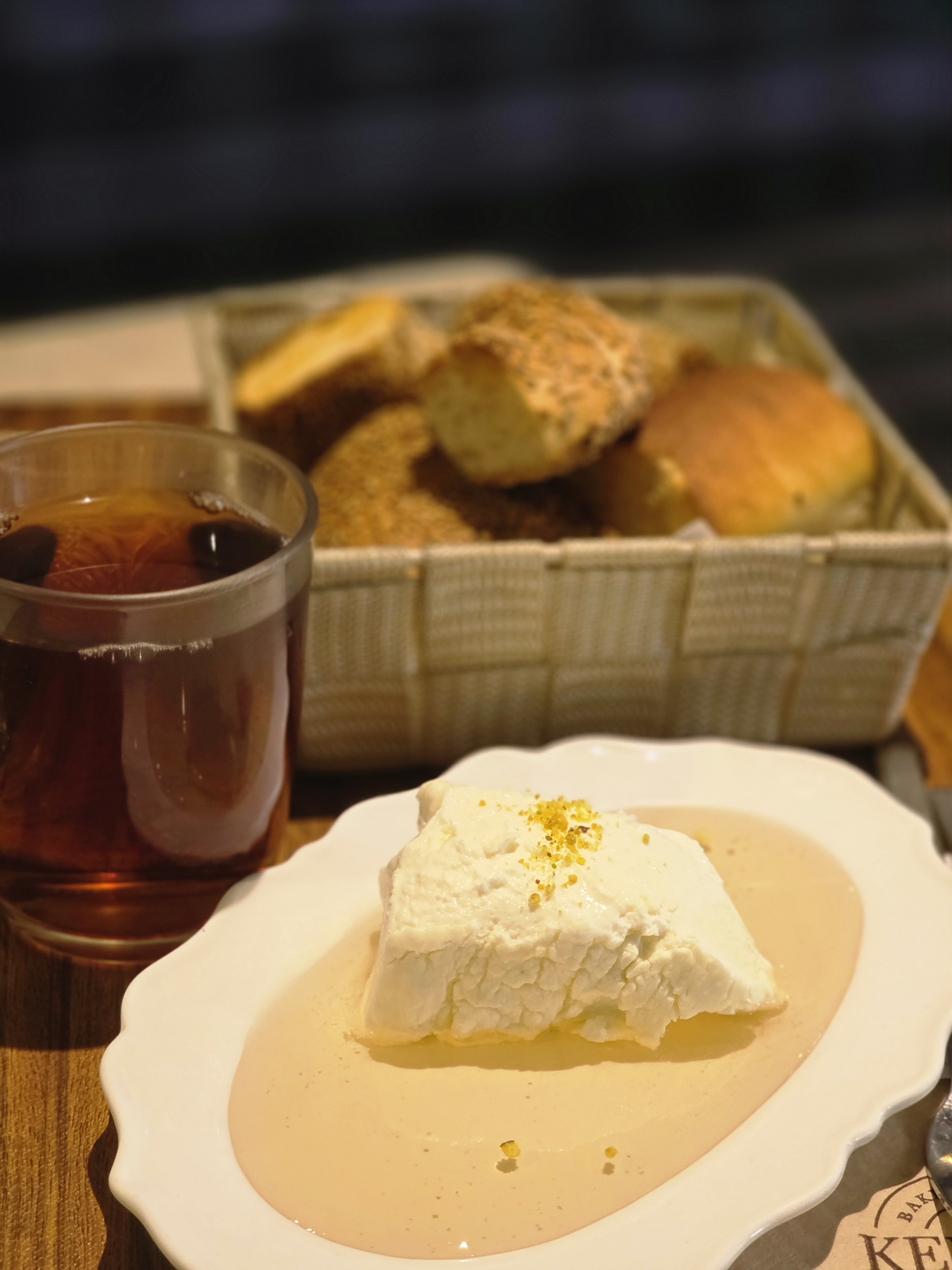 Turkish Kaymak clotted cream with wild honey, sliced artisan bread, and steeped black tea