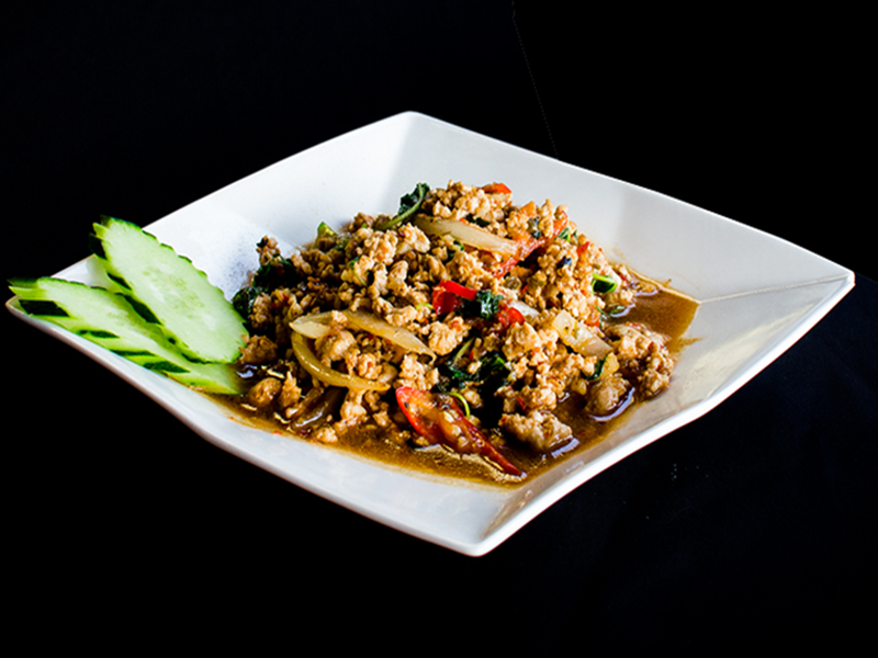 Pad Krapow minced pork wok-fried with holy basil, bird's eye chili, and cucumber slices