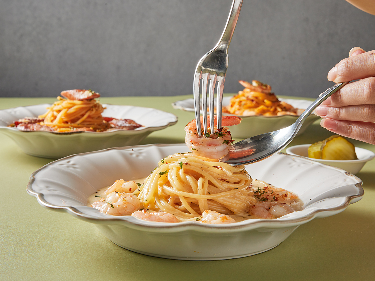 Detail of plump shrimp in cream pasta