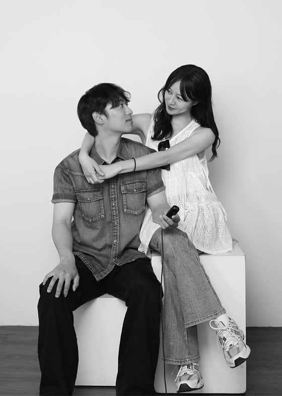 Black and white couple portrait with remote shutter release cable