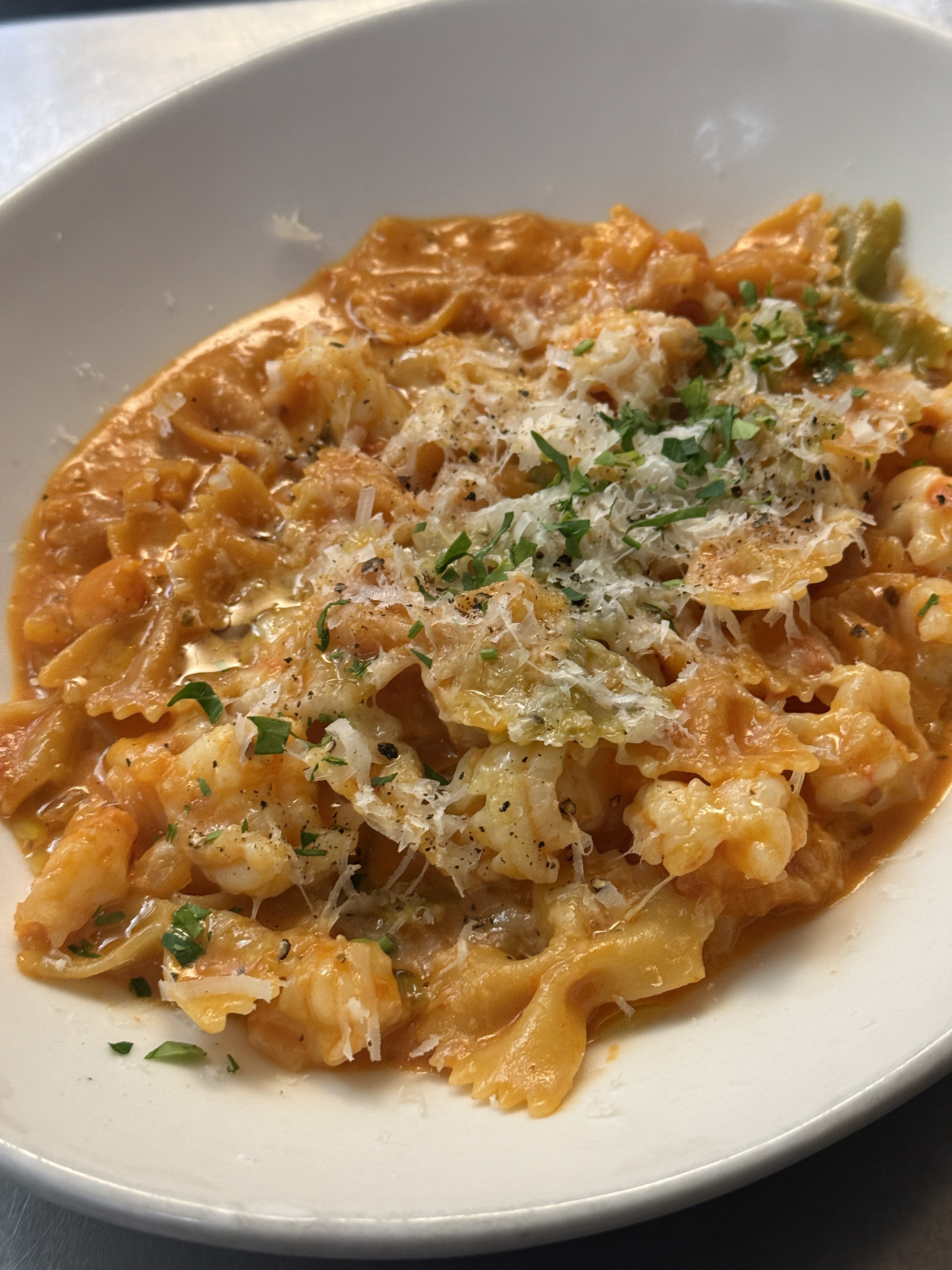 Farfalle pasta with succulent shrimp in a rich cream tomato sauce