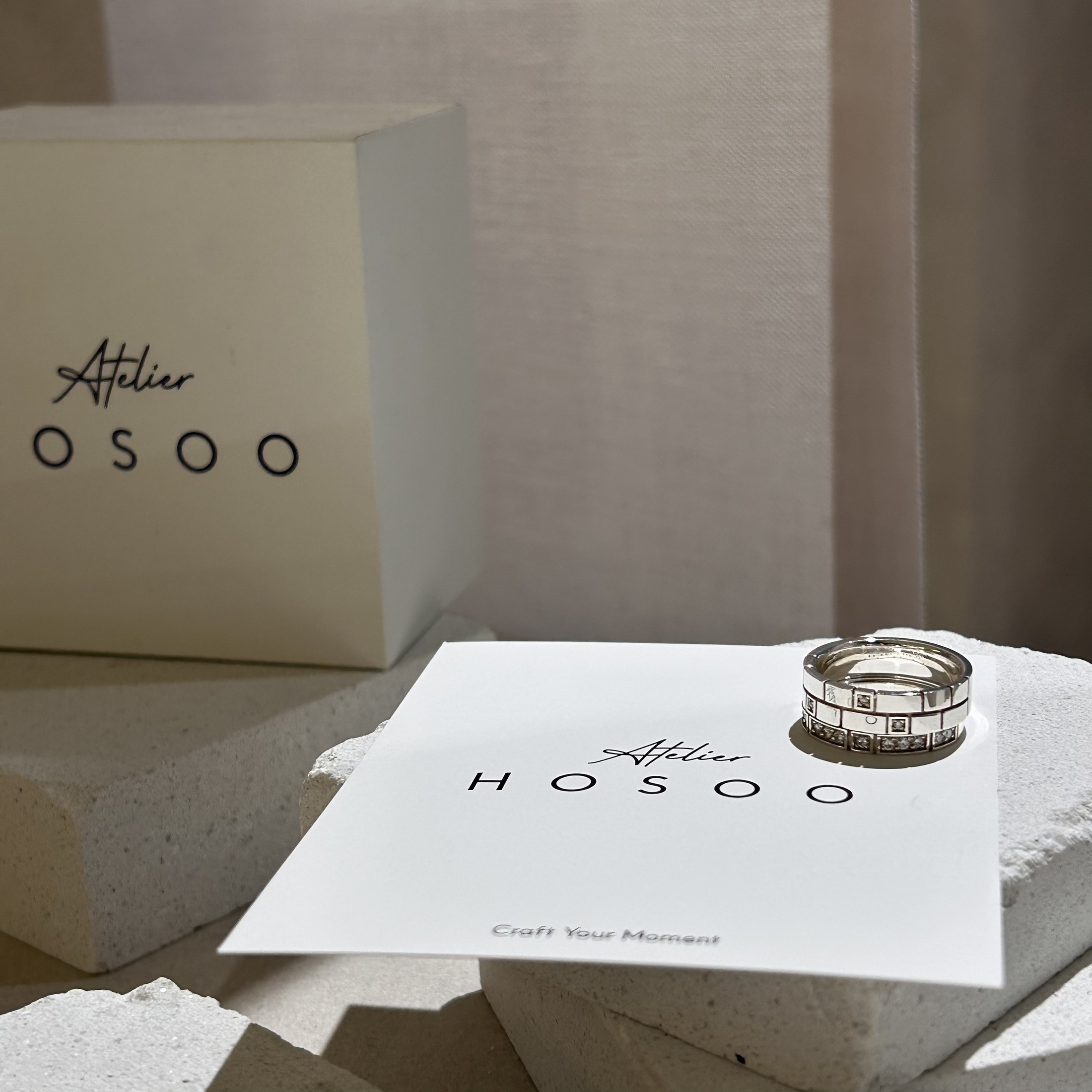 Silver rings displayed on white studio card