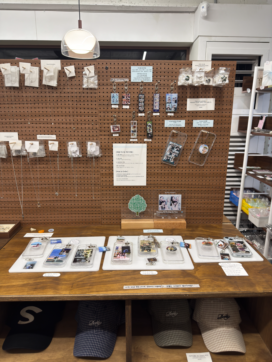 Wooden pegboard wall with personalized accessories and caps