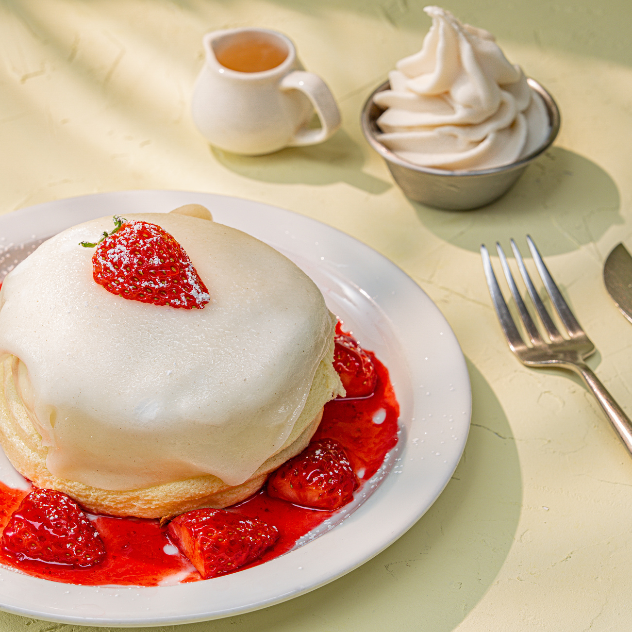 Souffle pancake with strawberry sauce