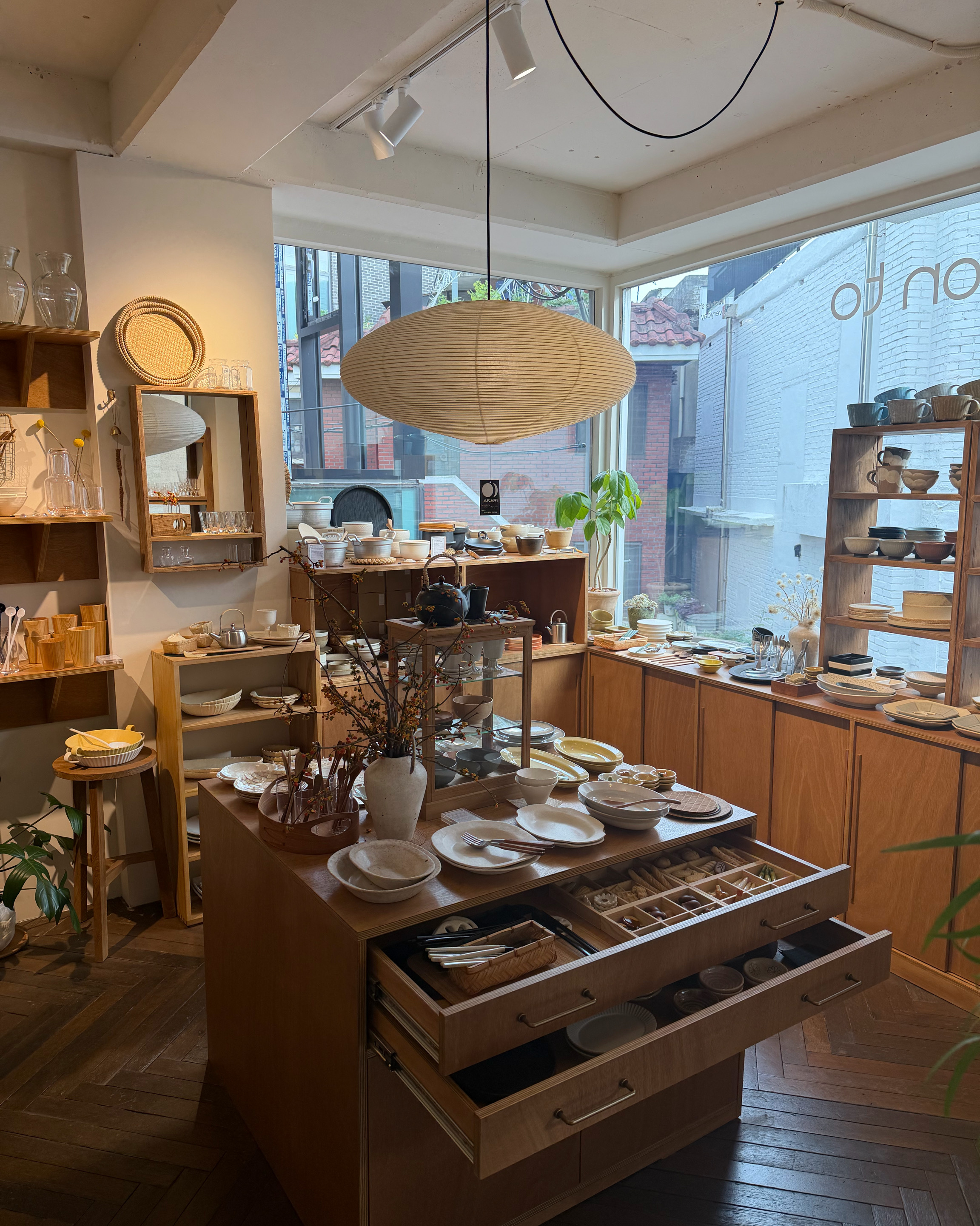 Overview of the boutique shop interior with wooden furniture.