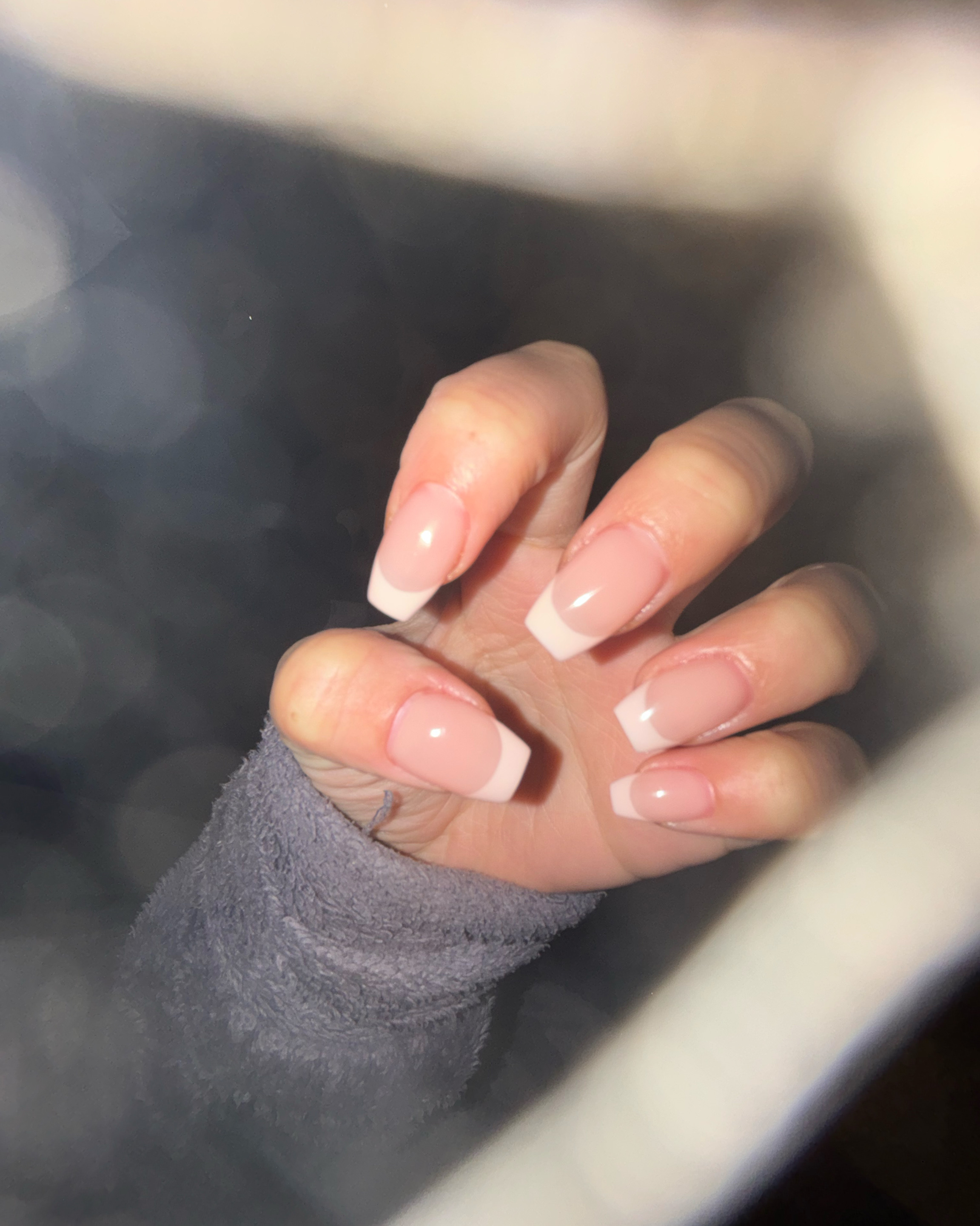 Square-shaped classic French manicure with clean nude pink base and crisp white tips