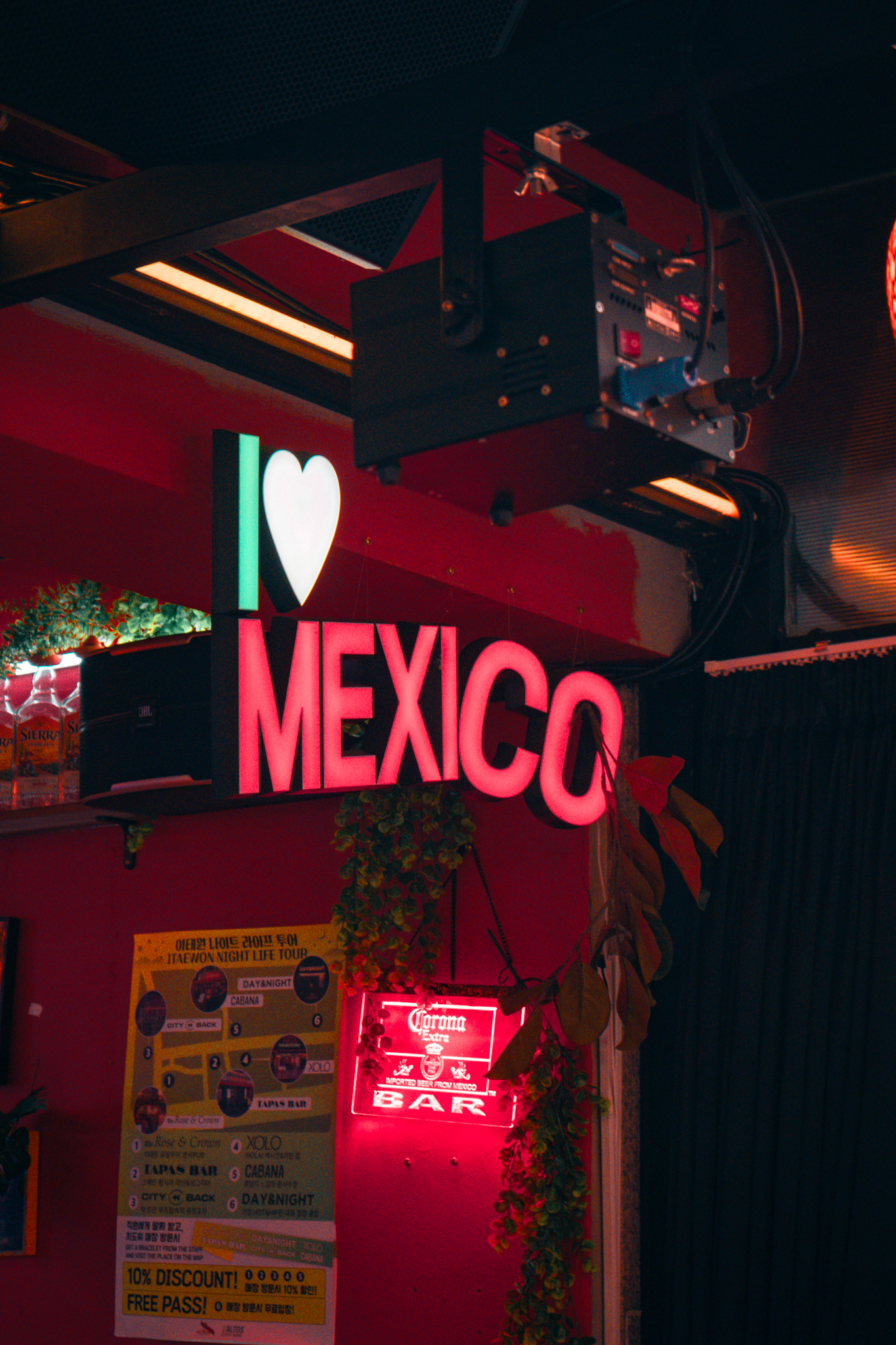 Vibrant red neon wall and Mexican cantina atmosphere inside XOLO