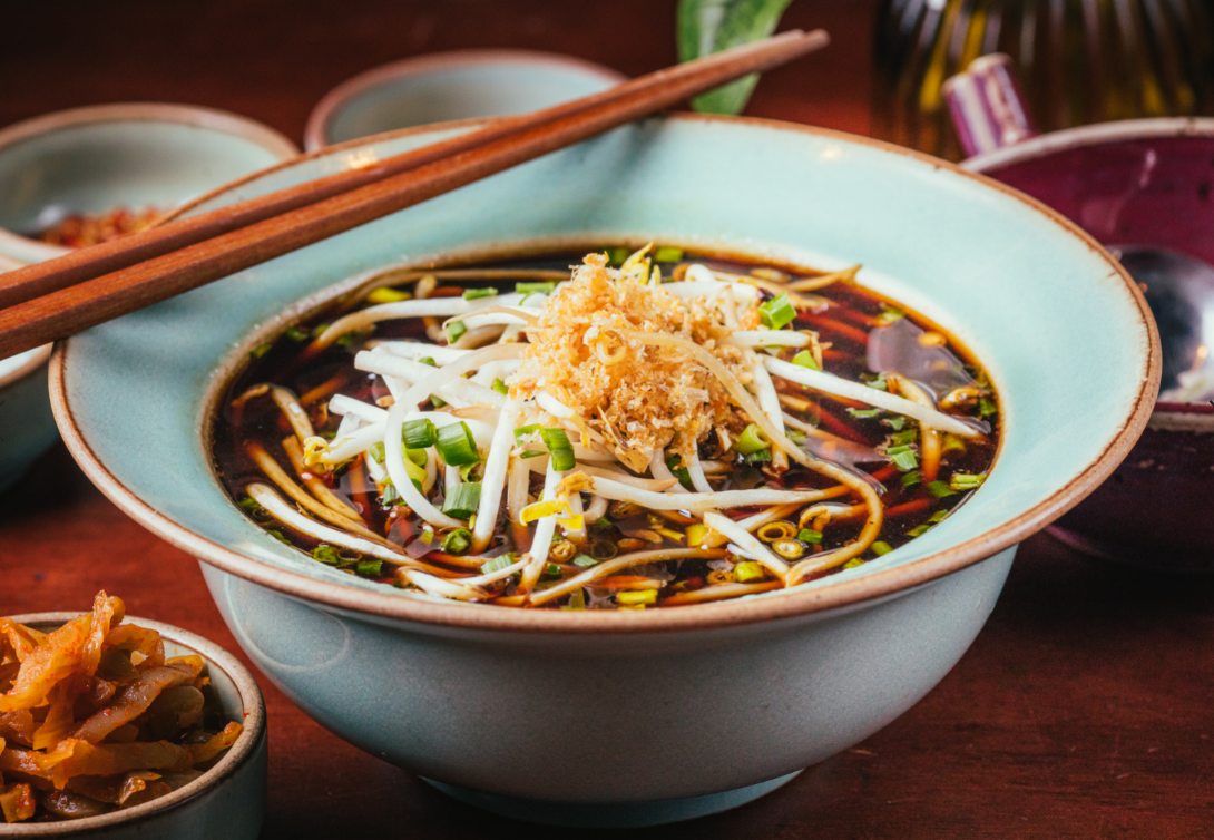 Traditional Thai noodle soup garnished with fresh bean sprouts