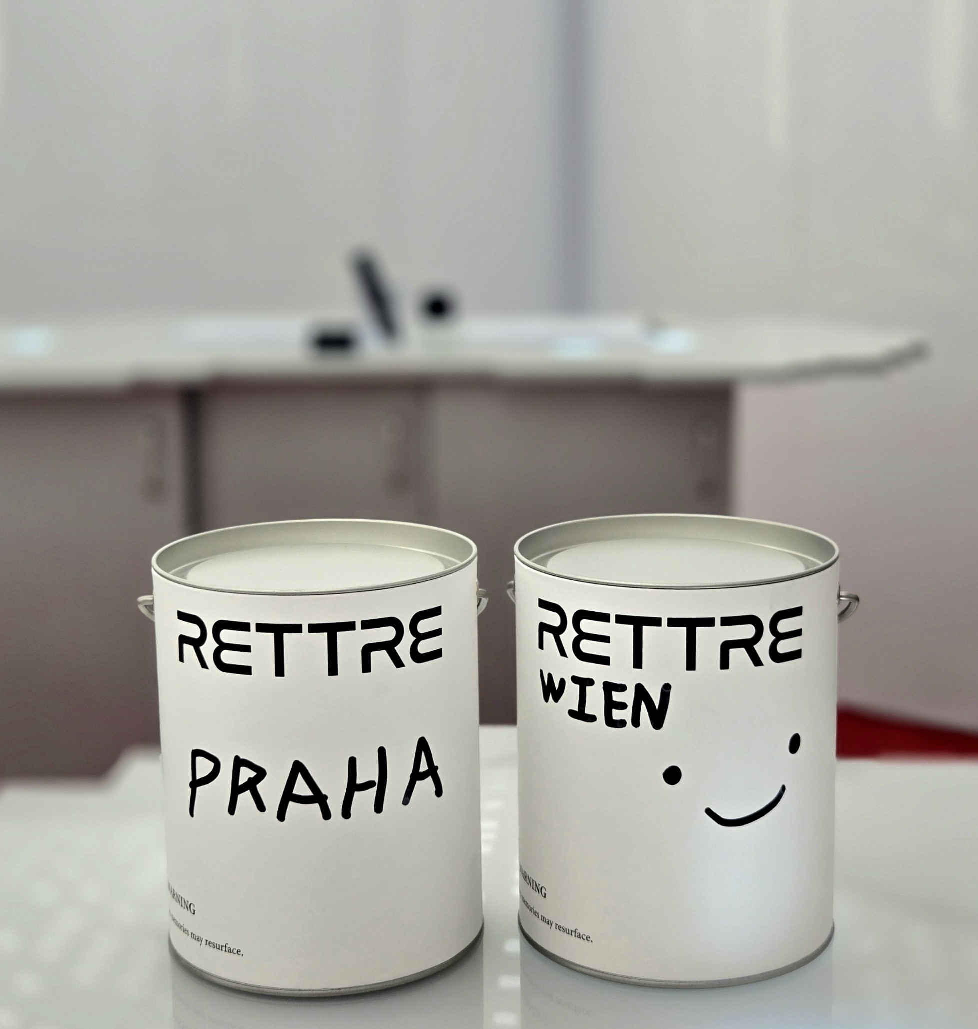 Custom labeled white metal canisters from the perfume atelier
