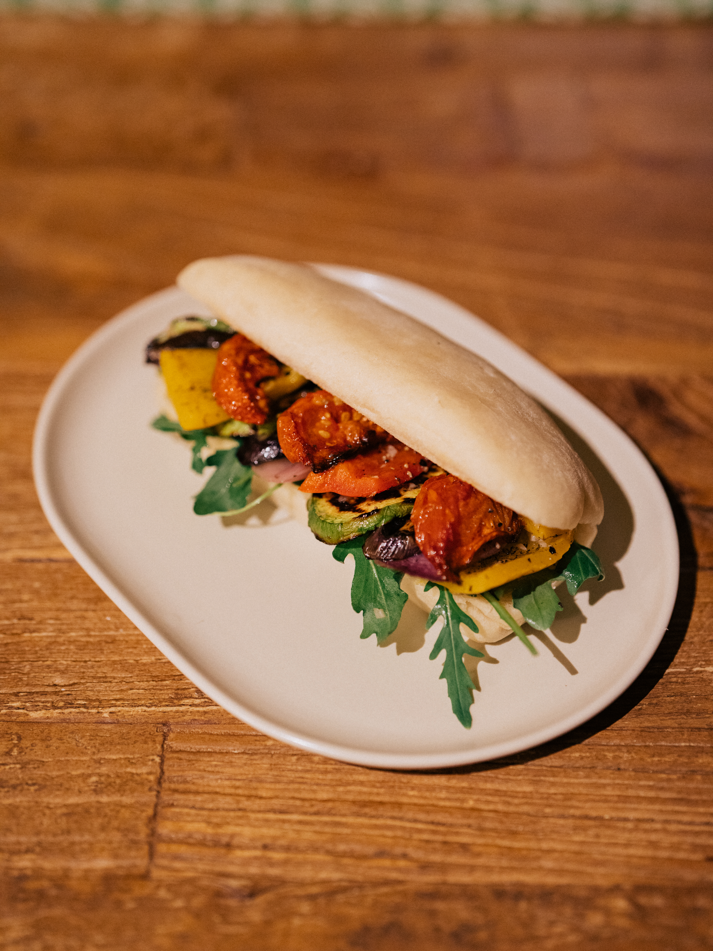 Roasted vegetable sandwich on a wooden table