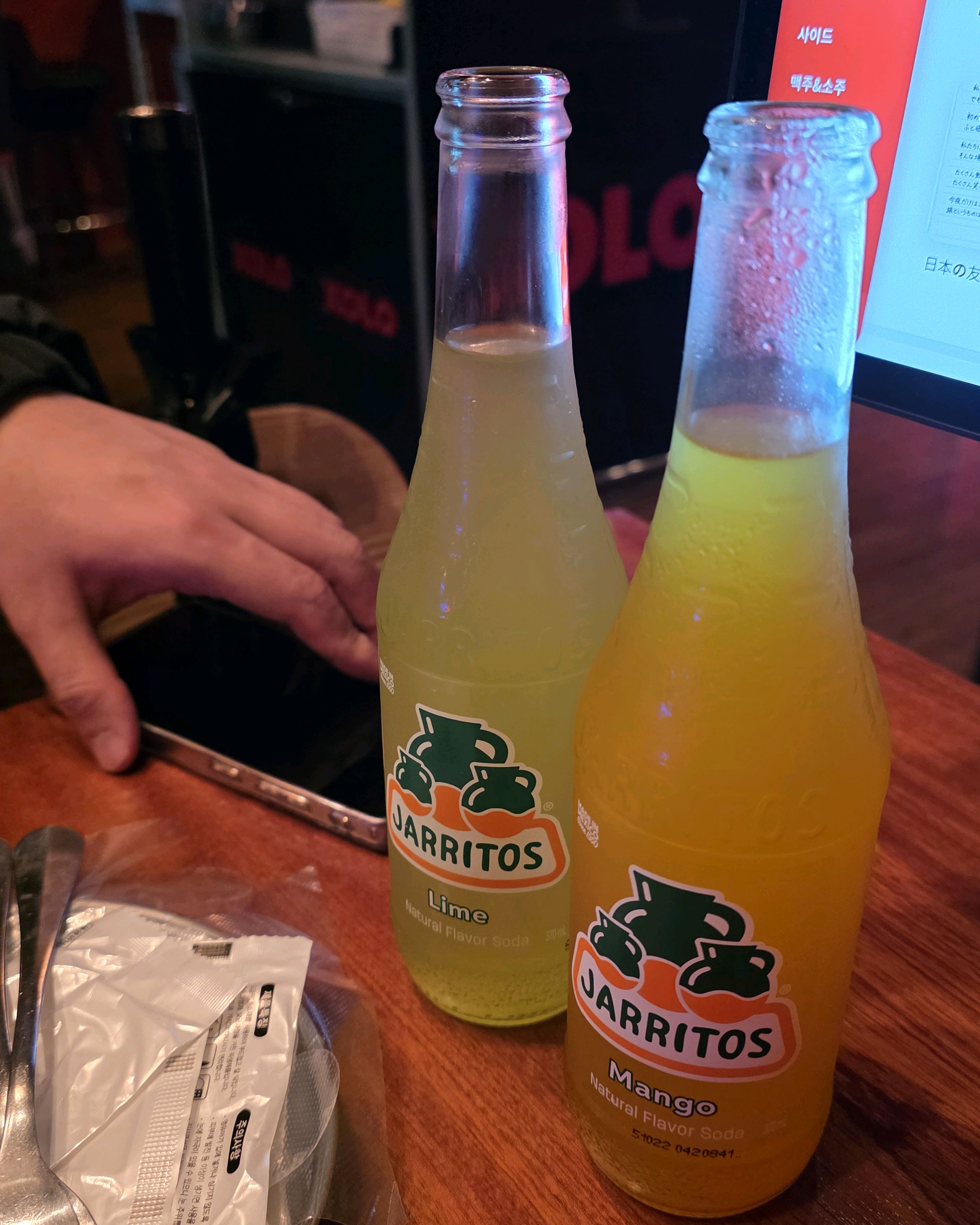 Chilled Mexican Jarritos soda bottles in lime and mango flavors