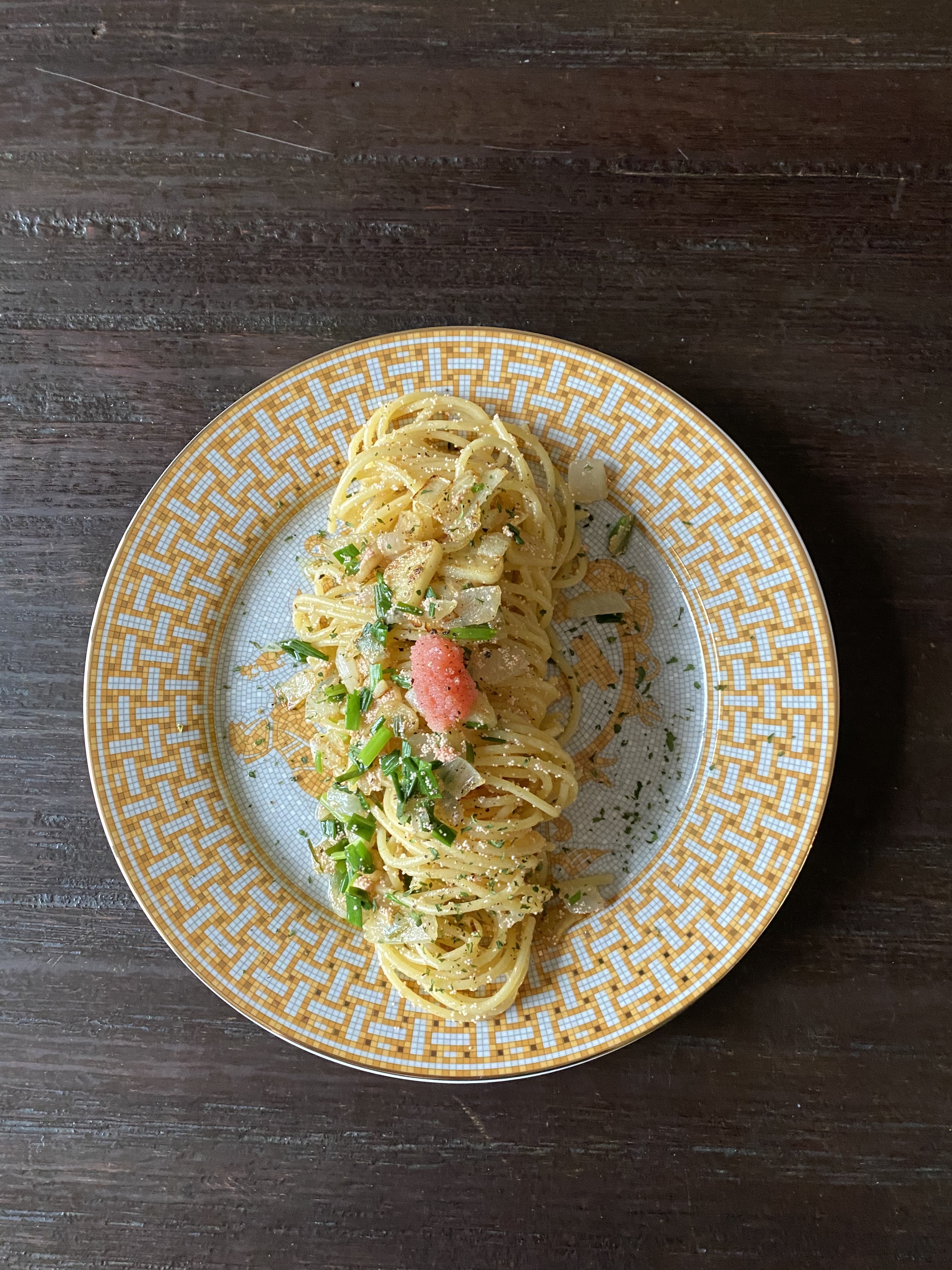 Specialty pasta with fresh herbs and roe garnish