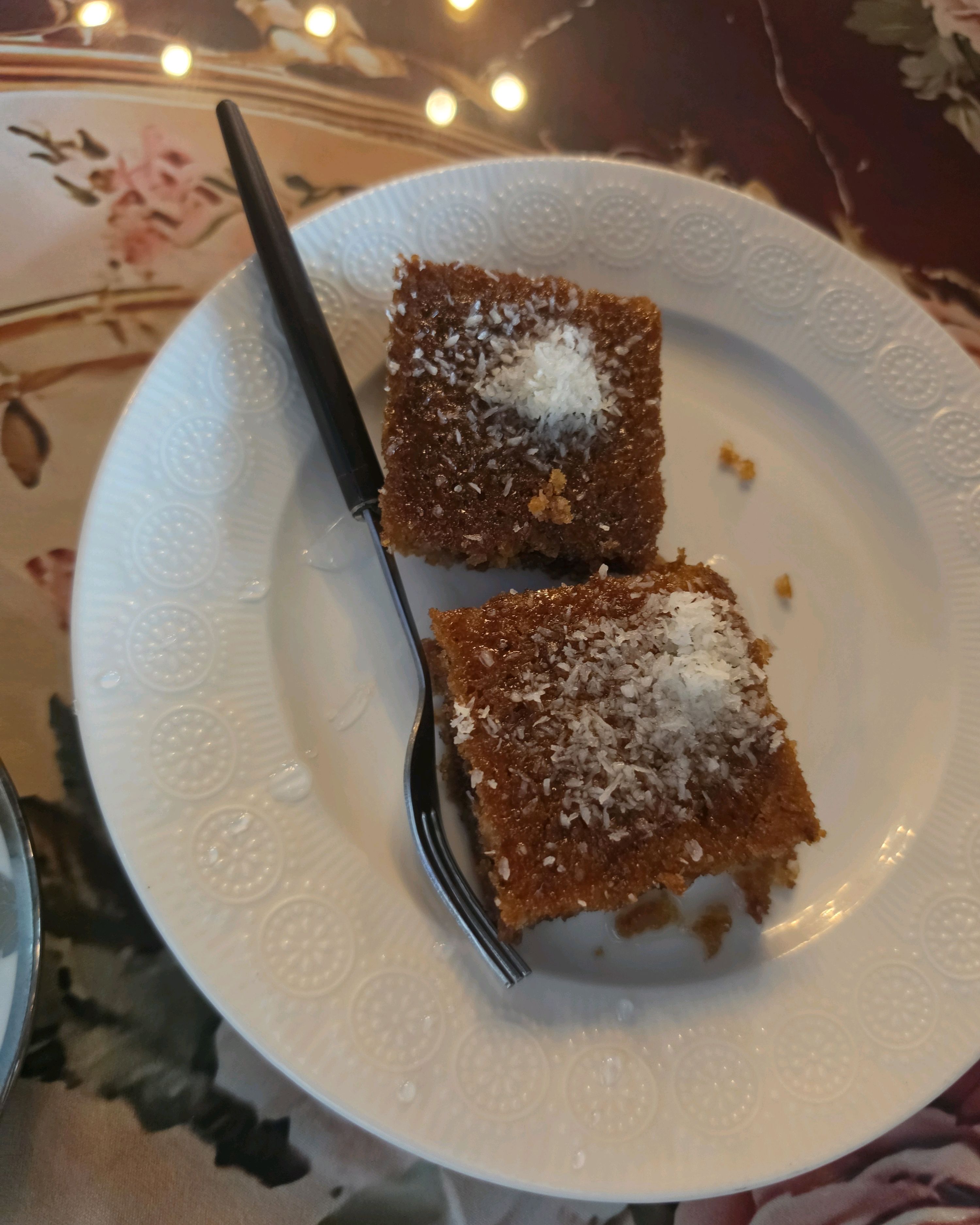 Traditional syrup-soaked semolina cake with coconut topping