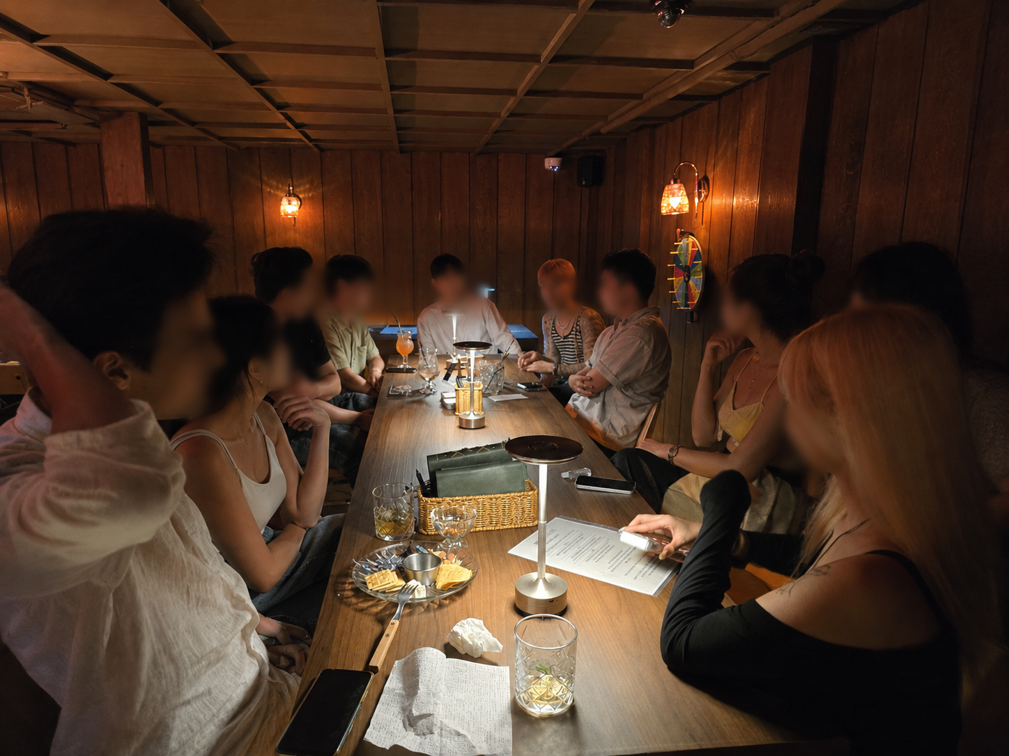Communal gathering around the long wooden table at Blending Bar