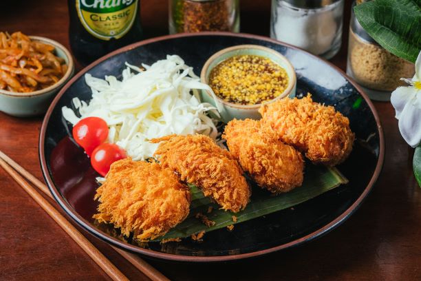 Golden fried shrimp cakes served with dipping sauce