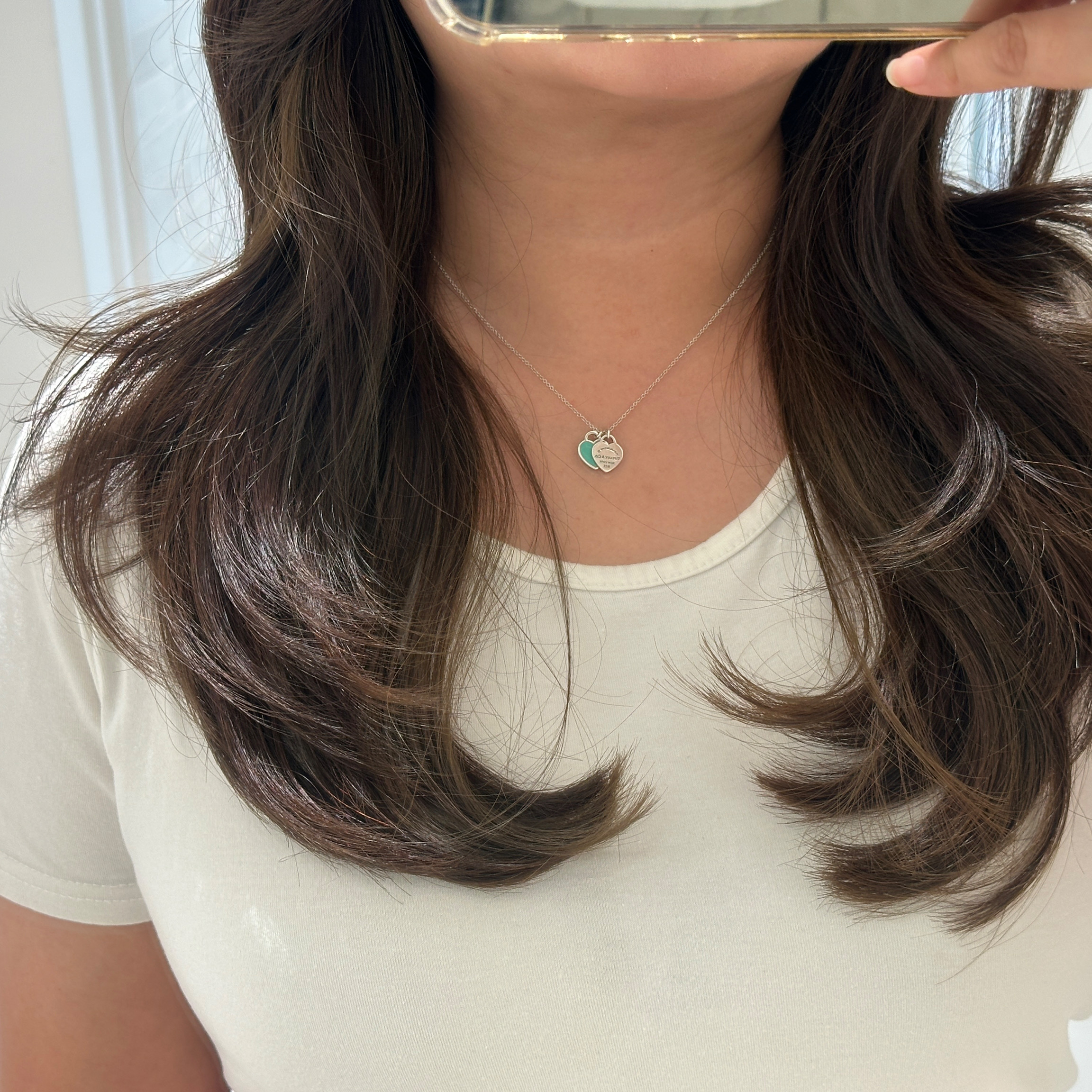 Close-up of styled long wavy dark brown hair demonstrating smooth texture and volume.