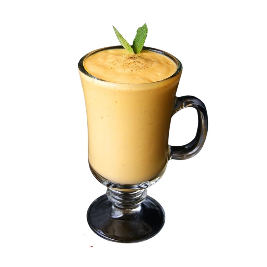 Refreshing chilled mango lassi garnished with mint leaves