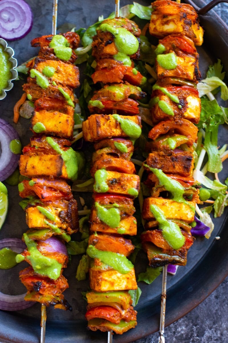 Grilled paneer skewers with bell peppers and fresh green herb chutney