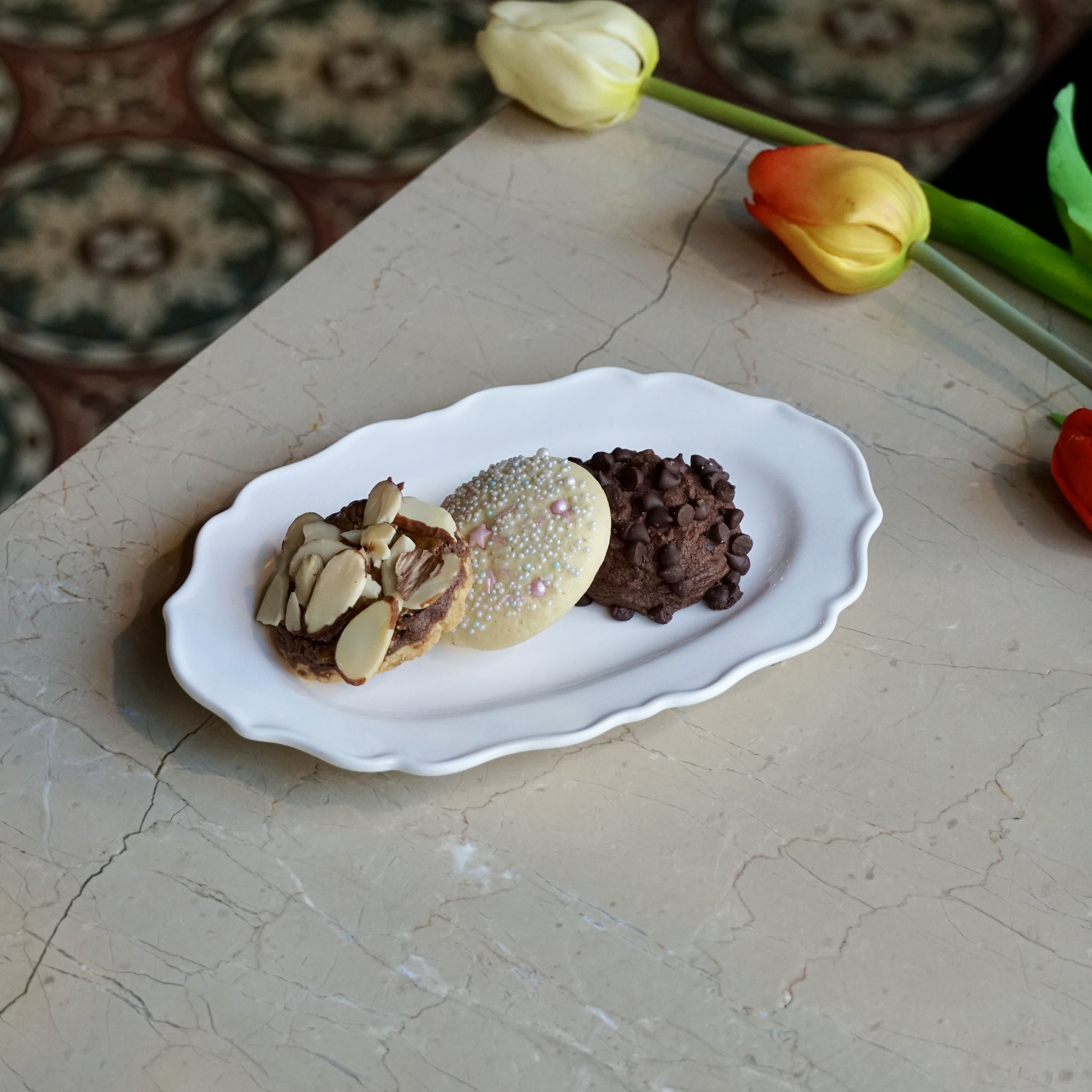 Platter of handmade Turkish cookies with almonds, sprinkles, and chocolate chips