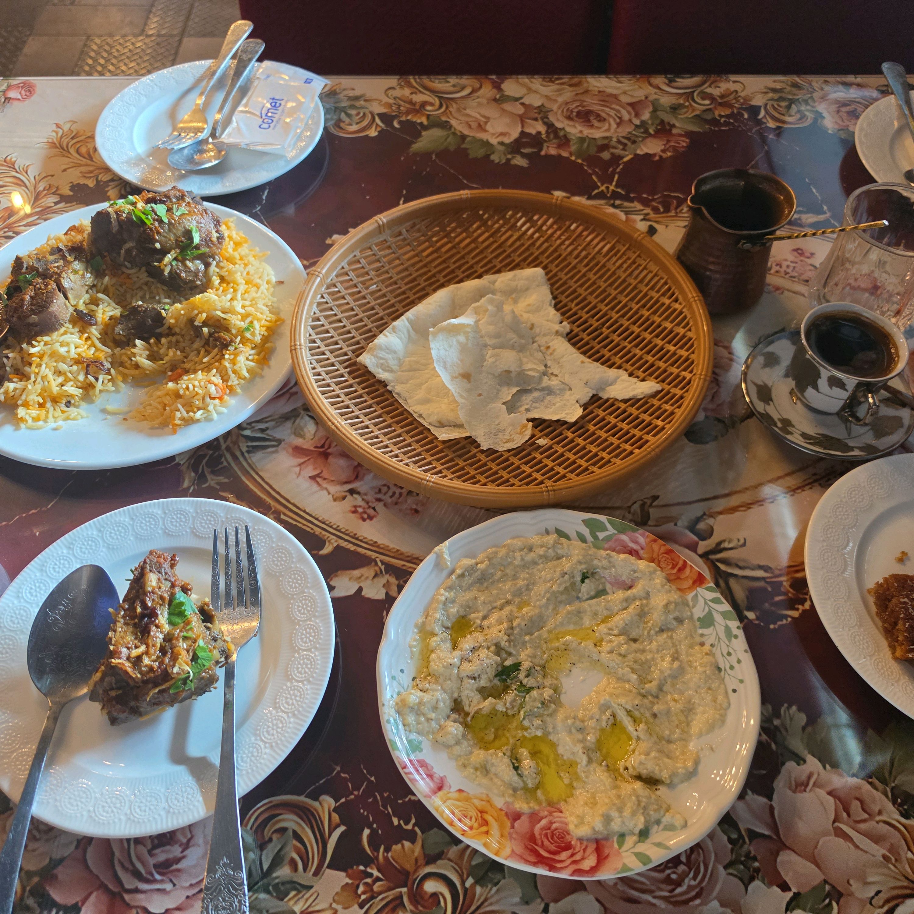 Middle Eastern clay pot stews and spreads on table