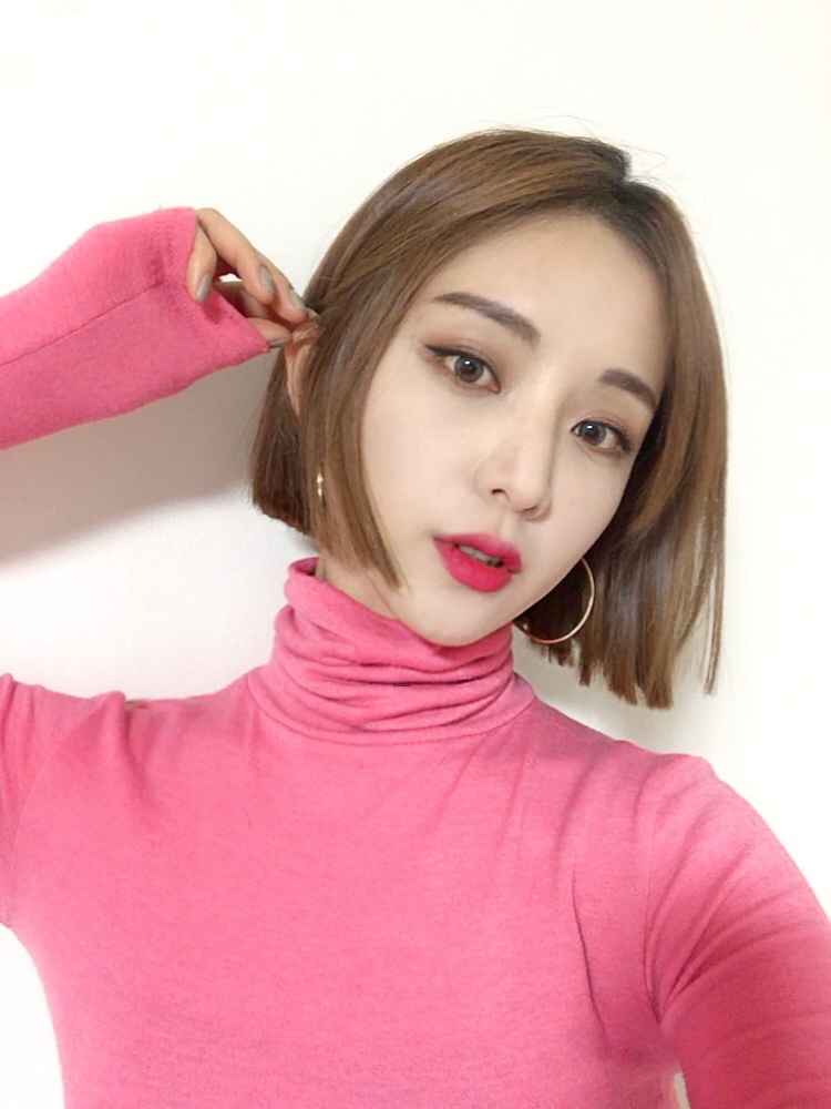 Blunt short brown bob haircut with sleek structure