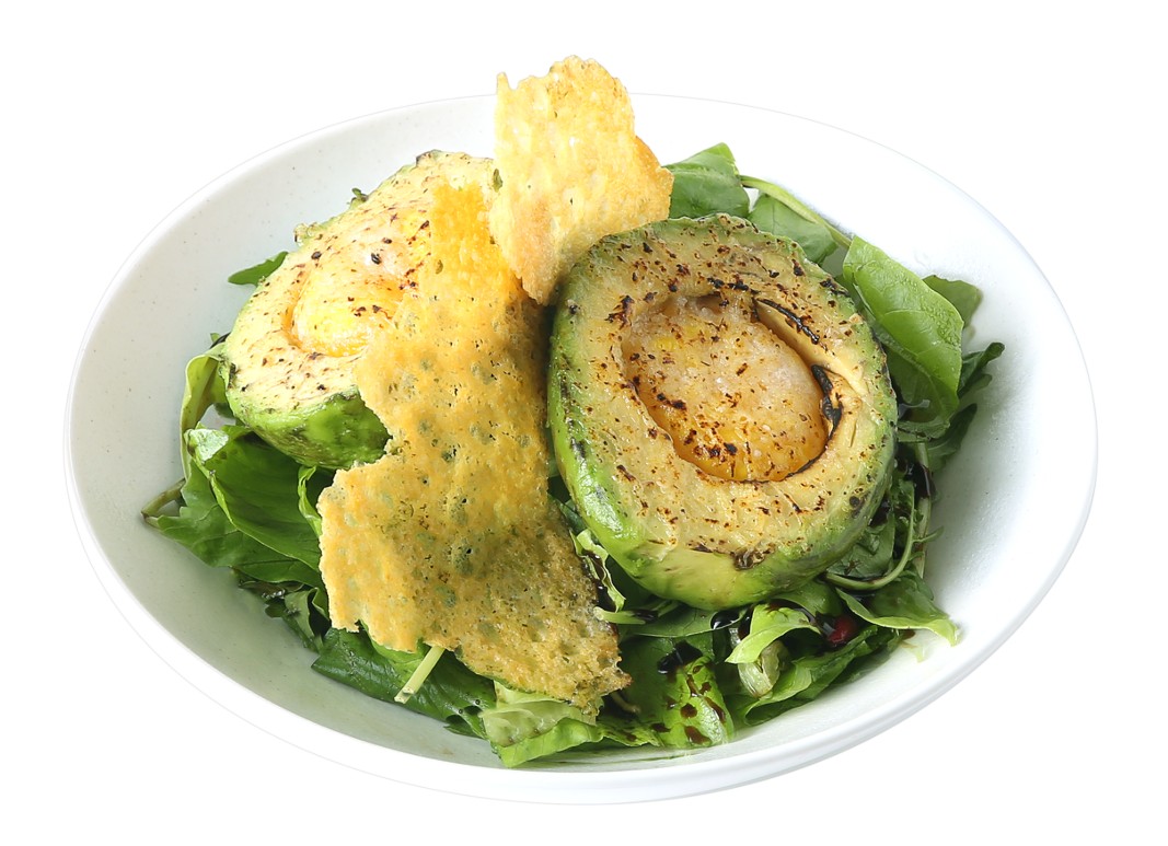 Grilled avocado halves with baked egg, crisp cheese tuile, and garden salad
