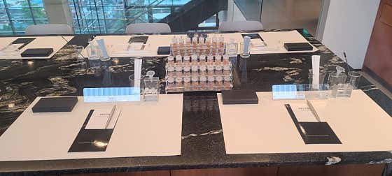 Black workstation table set with scent testing strips and tablet guides