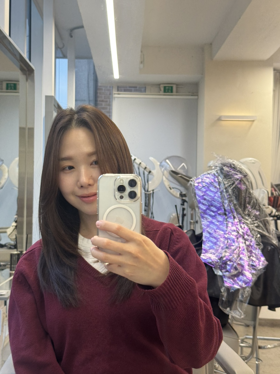 Salon interior mirror perspective showing professional treatment space