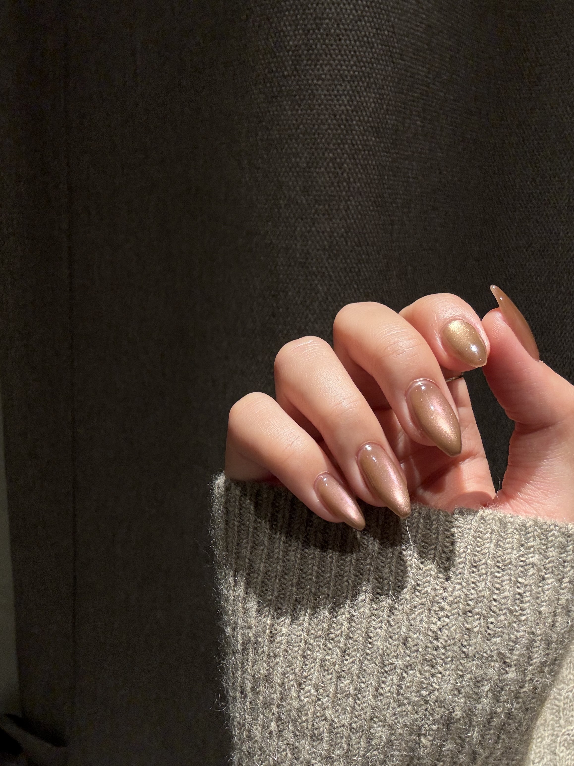 High-gloss metallic bronze mocha almond shaped manicure