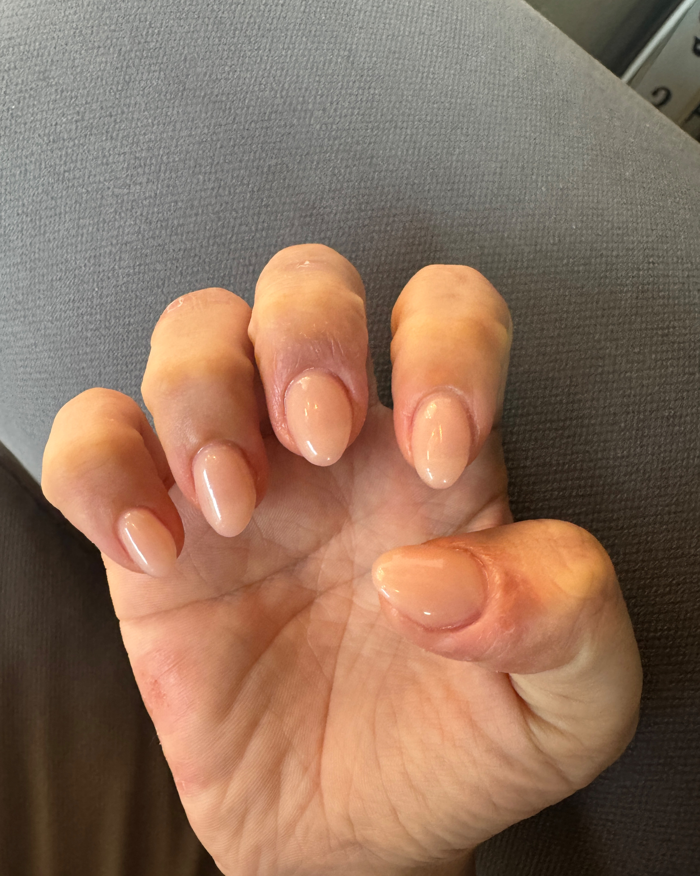 Clean natural nude gel manicure with glossy finish