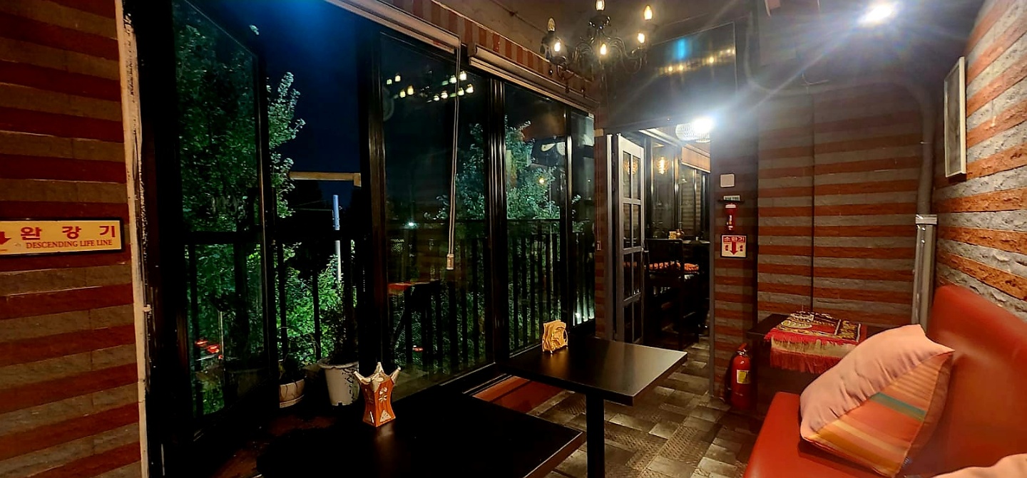 Dining room booth seating and evening window view