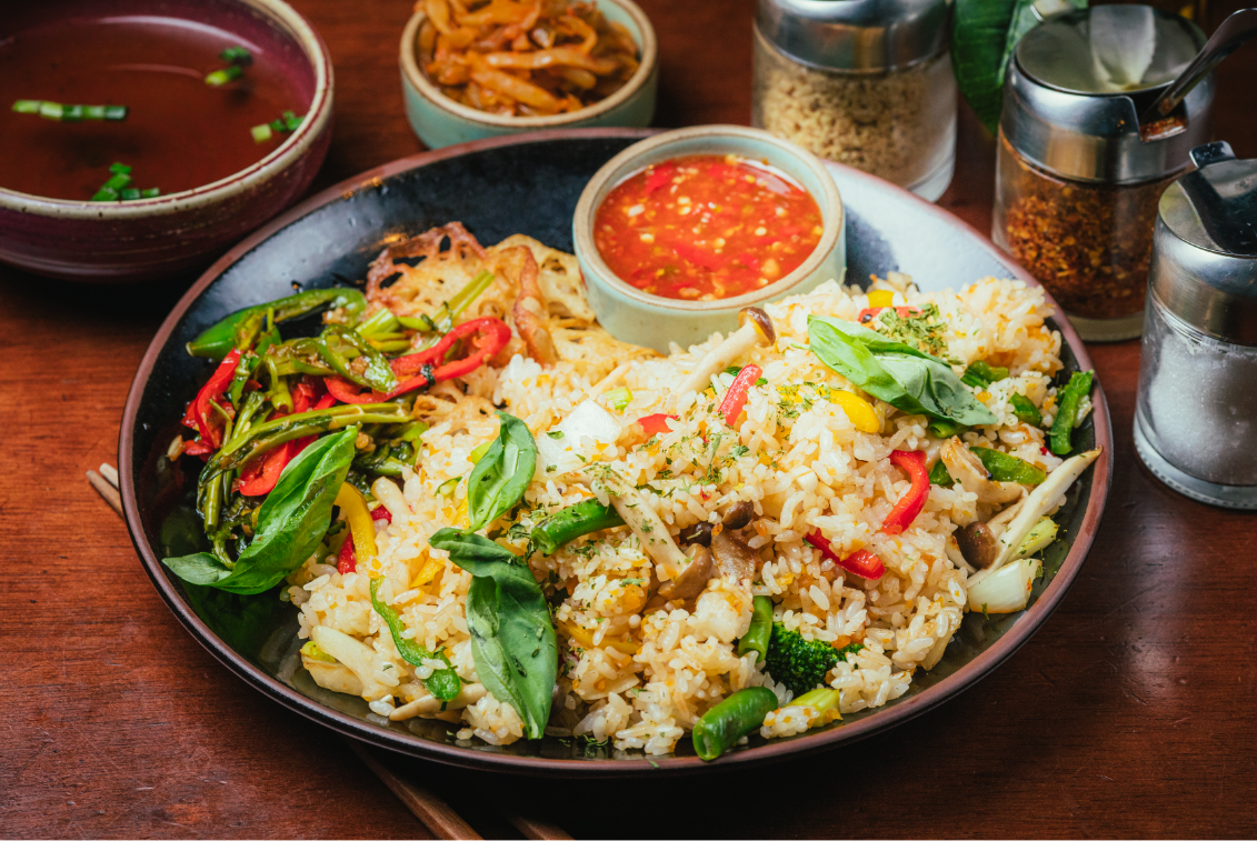 Thai vegetable fried rice served with authentic chili sauce