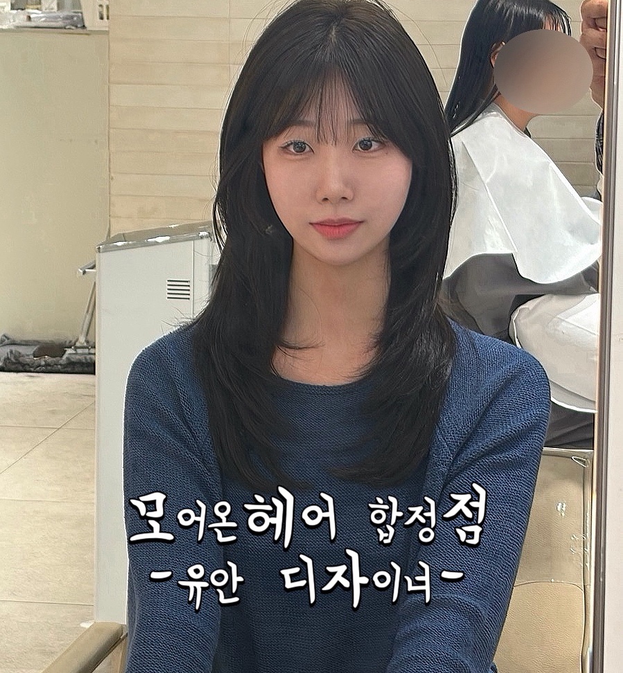 Medium-length layered dark hair styling result at Hapjeong studio.