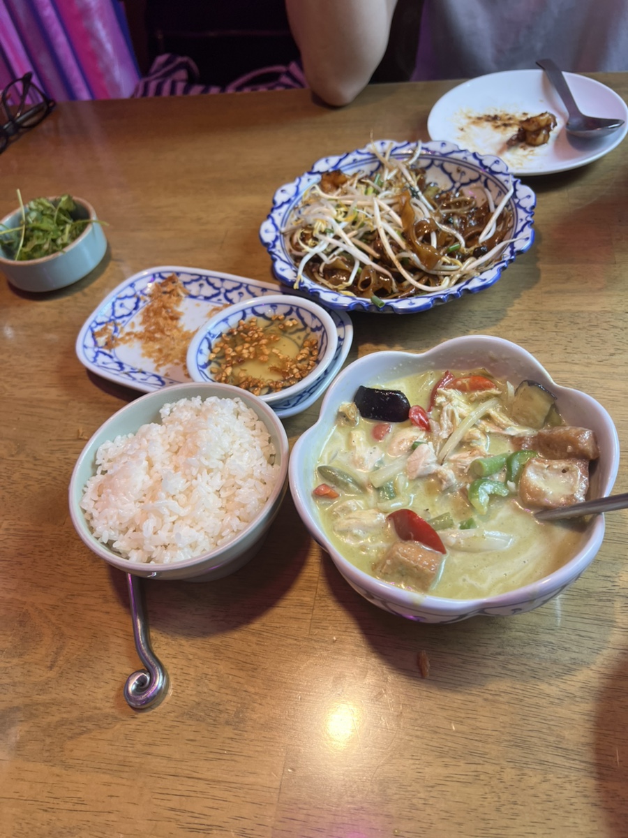 Assorted Thai dishes and curries served on dining table