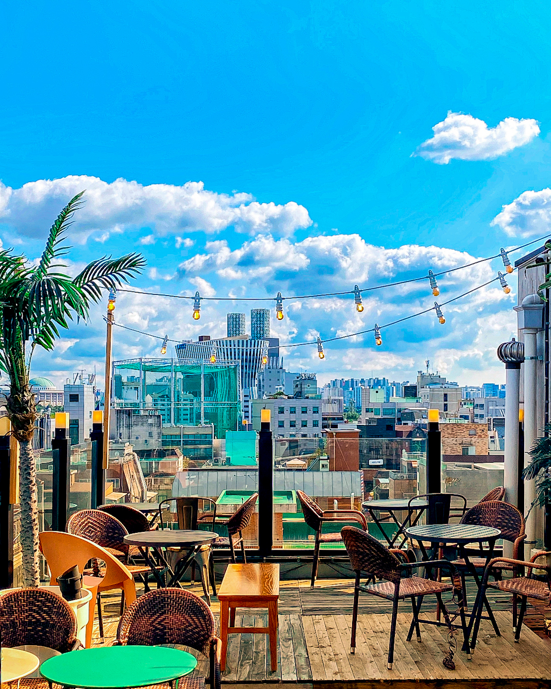 Rooftop terrace seating looking out across the cityscape of Seoul