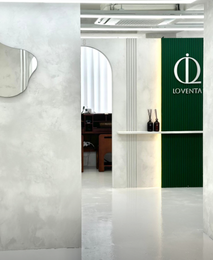 Green Loventa logo wall inside the Suwon Haenggung studio