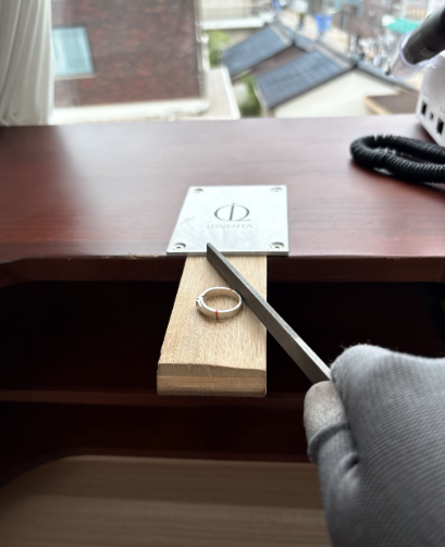 Filing a ring at a wooden Loventa workbench