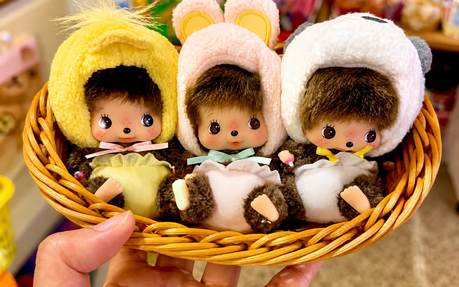 Monchhichi dolls in a basket
