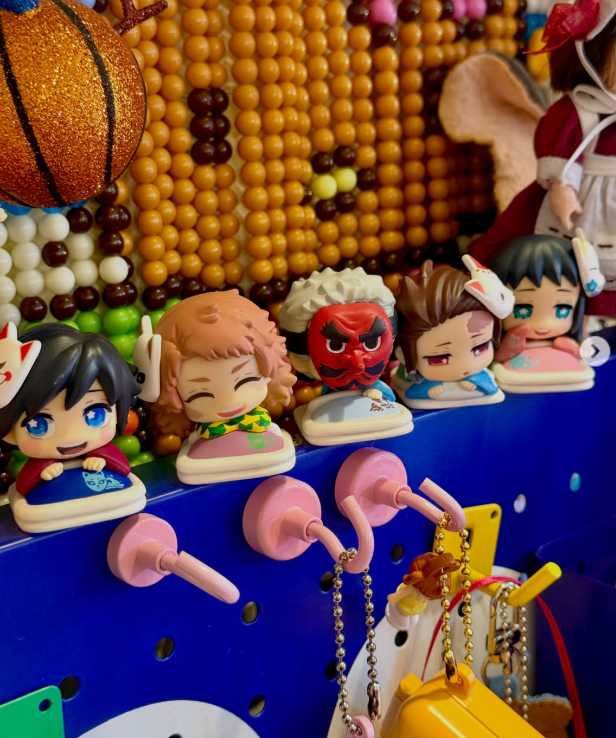 Small anime character figures on a blue display