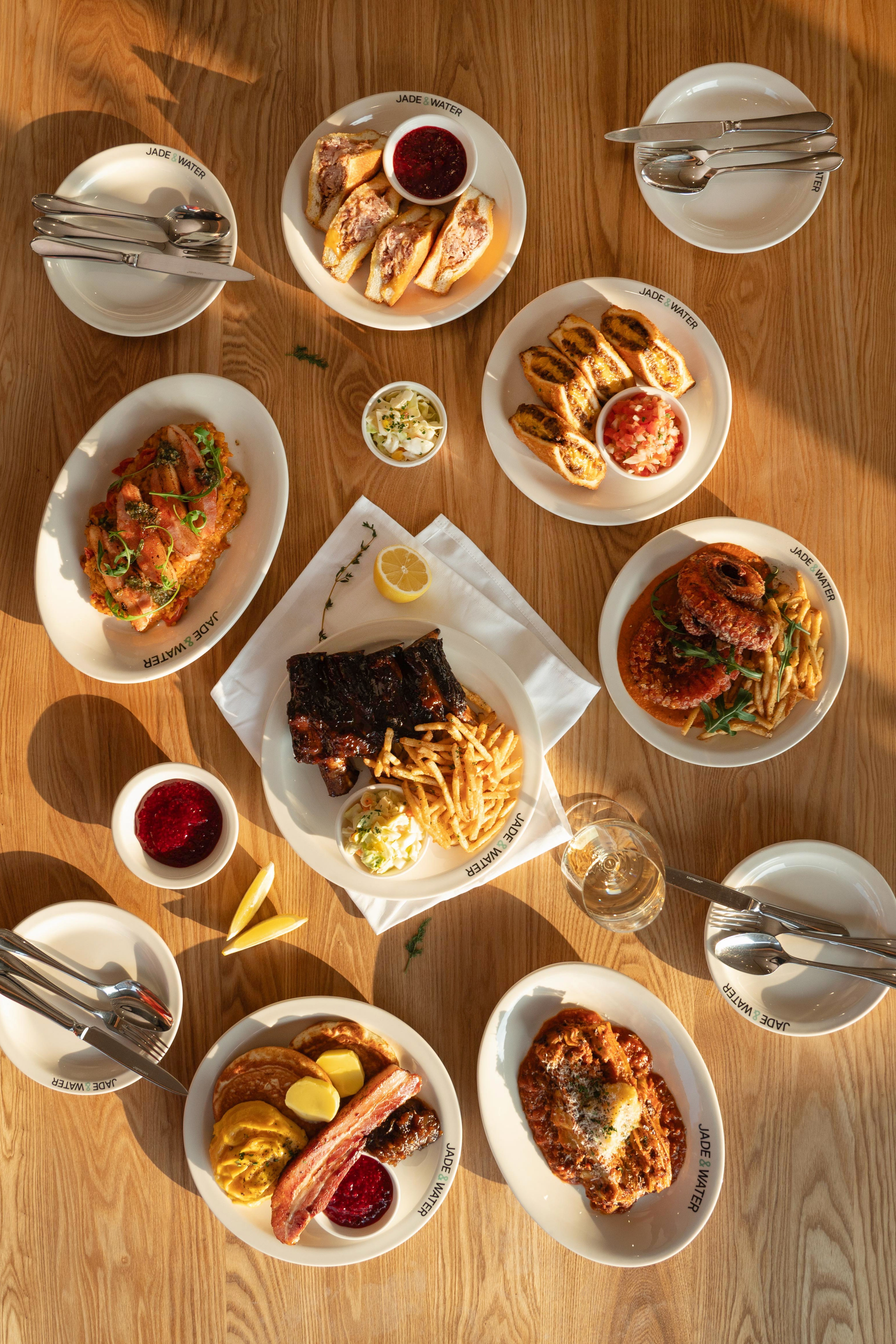 A spread of brunch and dining dishes at Jade & Water Oksu