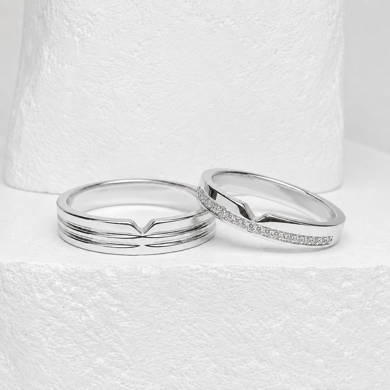 Silver ring pair with a floral stone setting