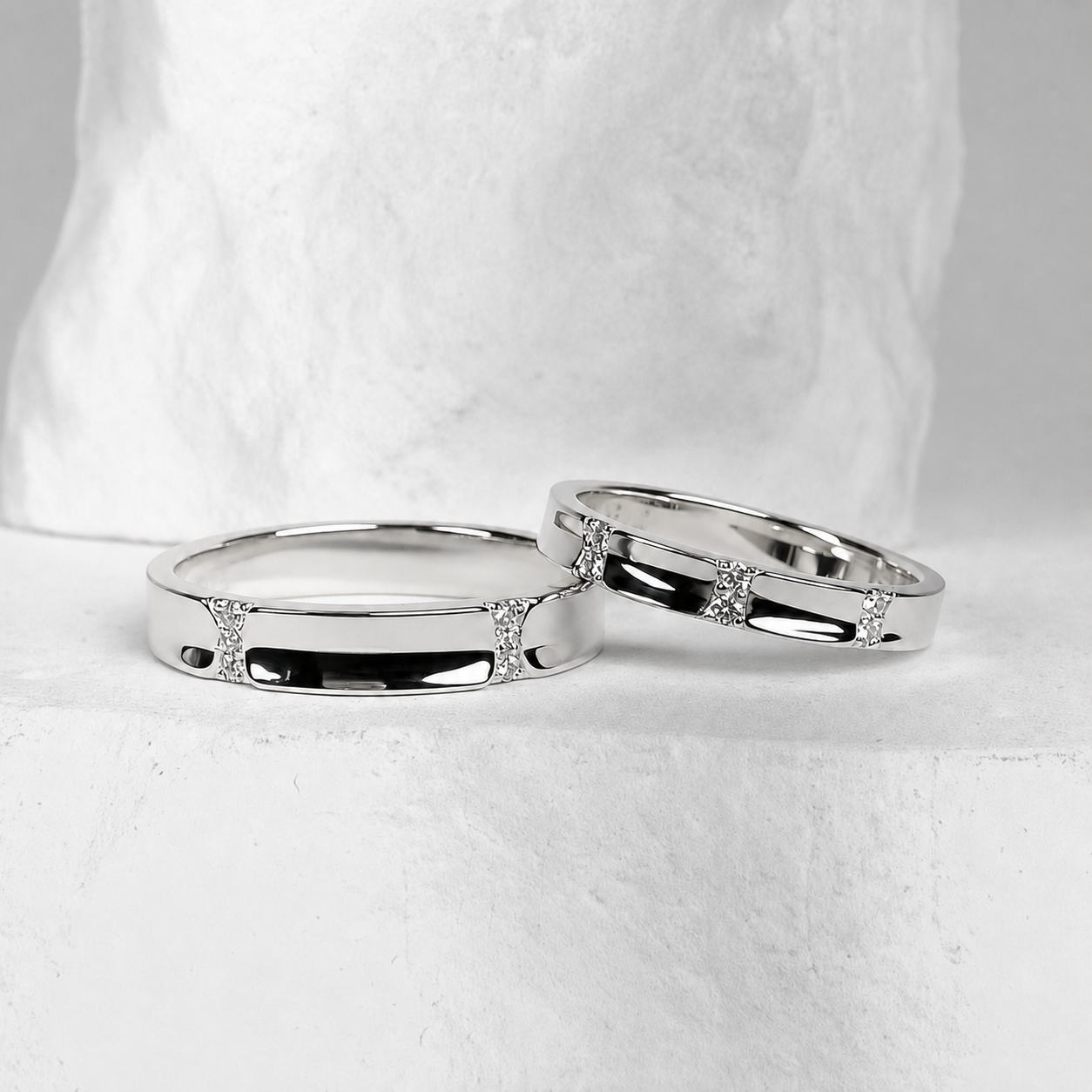 Polished silver bands with inset stones